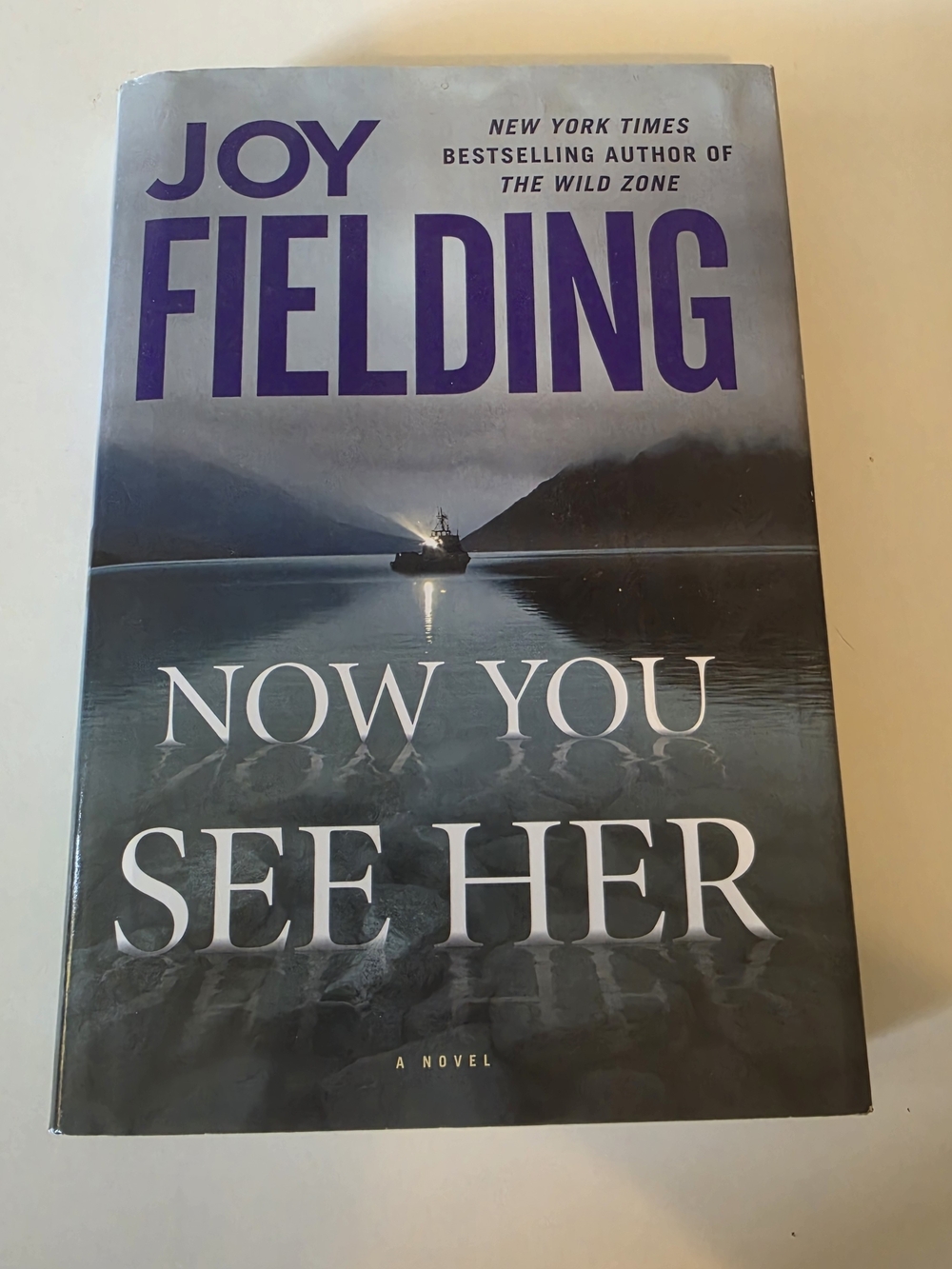 Now You See Her by Joy Fielding - Hardcover Novel (Blue/Purple Cover)